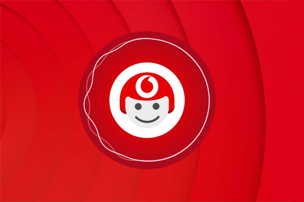 TOBi smiling on red curved background 
